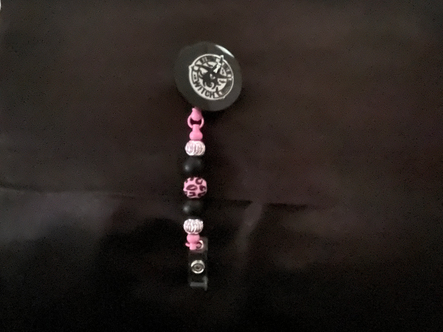 Wicked themed badge reels