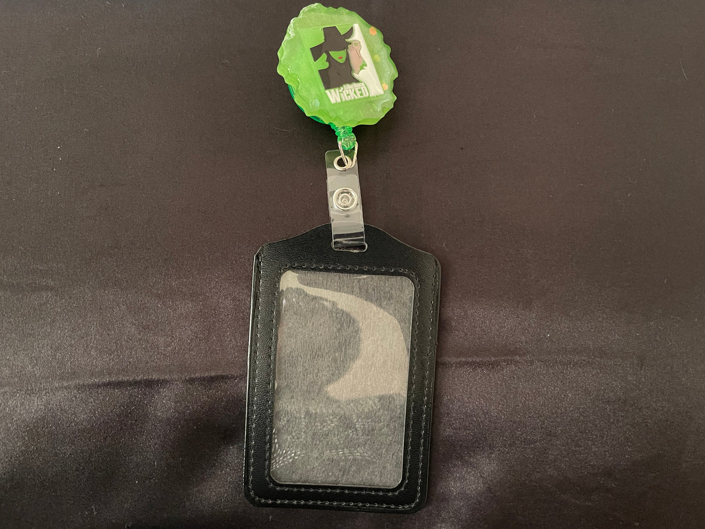 Wicked themed badge reels