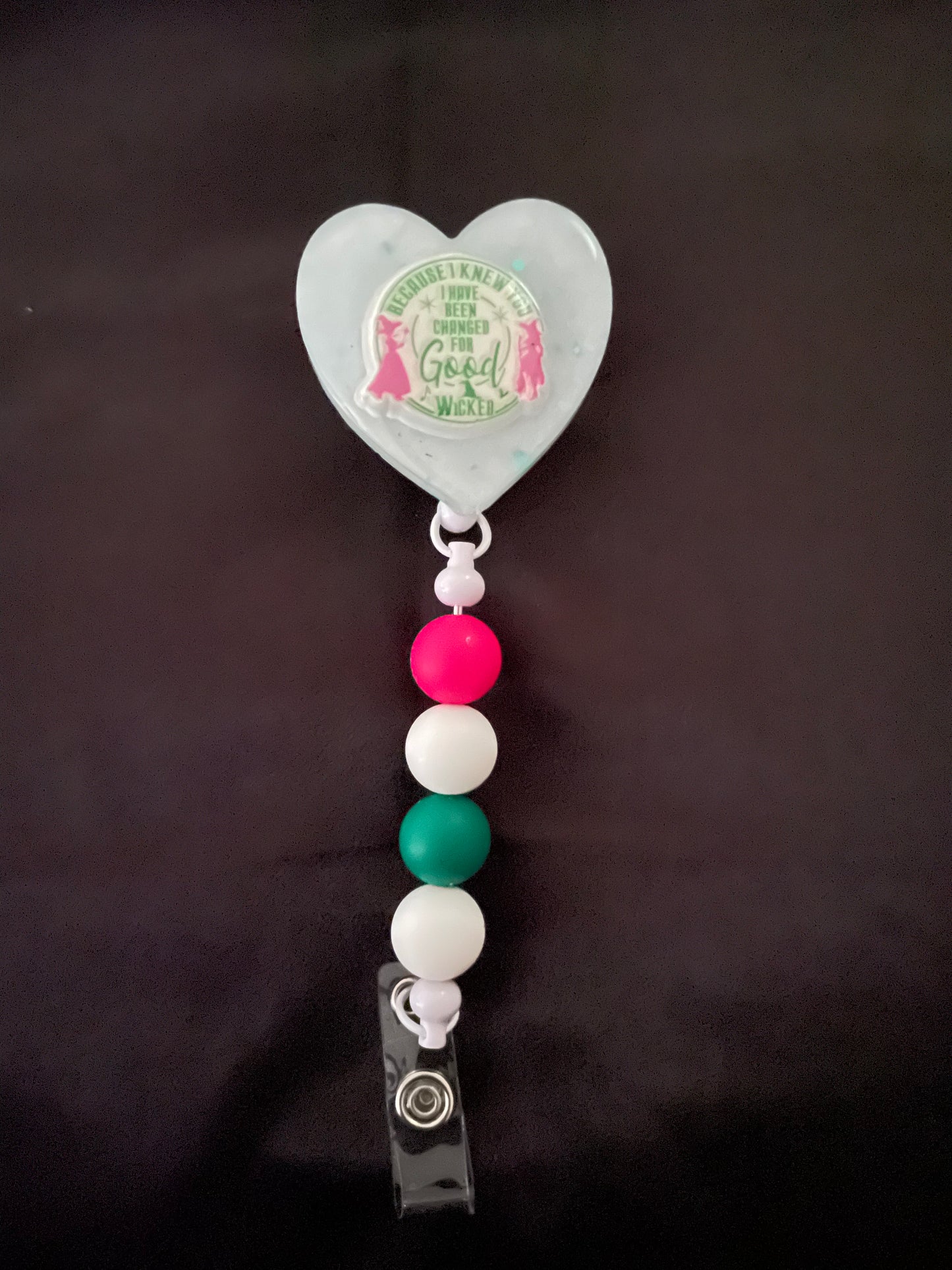 Wicked themed badge reels