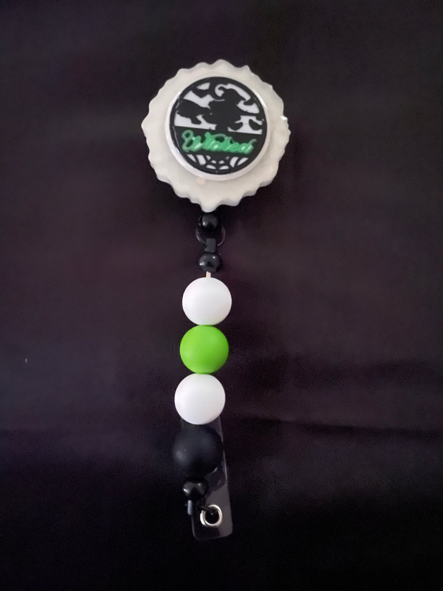 Wicked themed badge reels