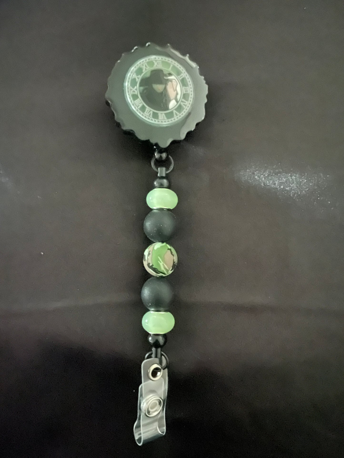 Wicked themed badge reels