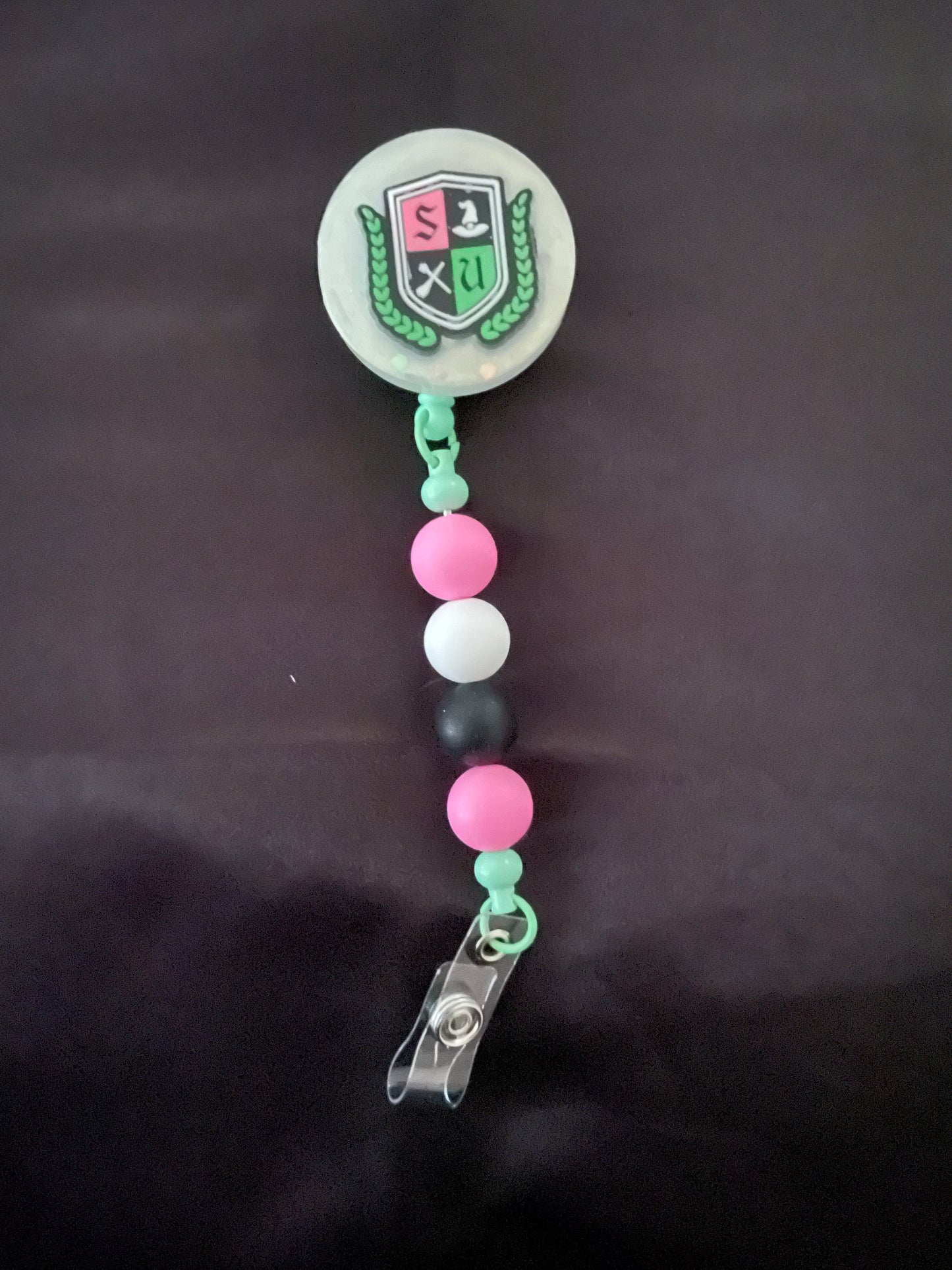Wicked themed badge reels