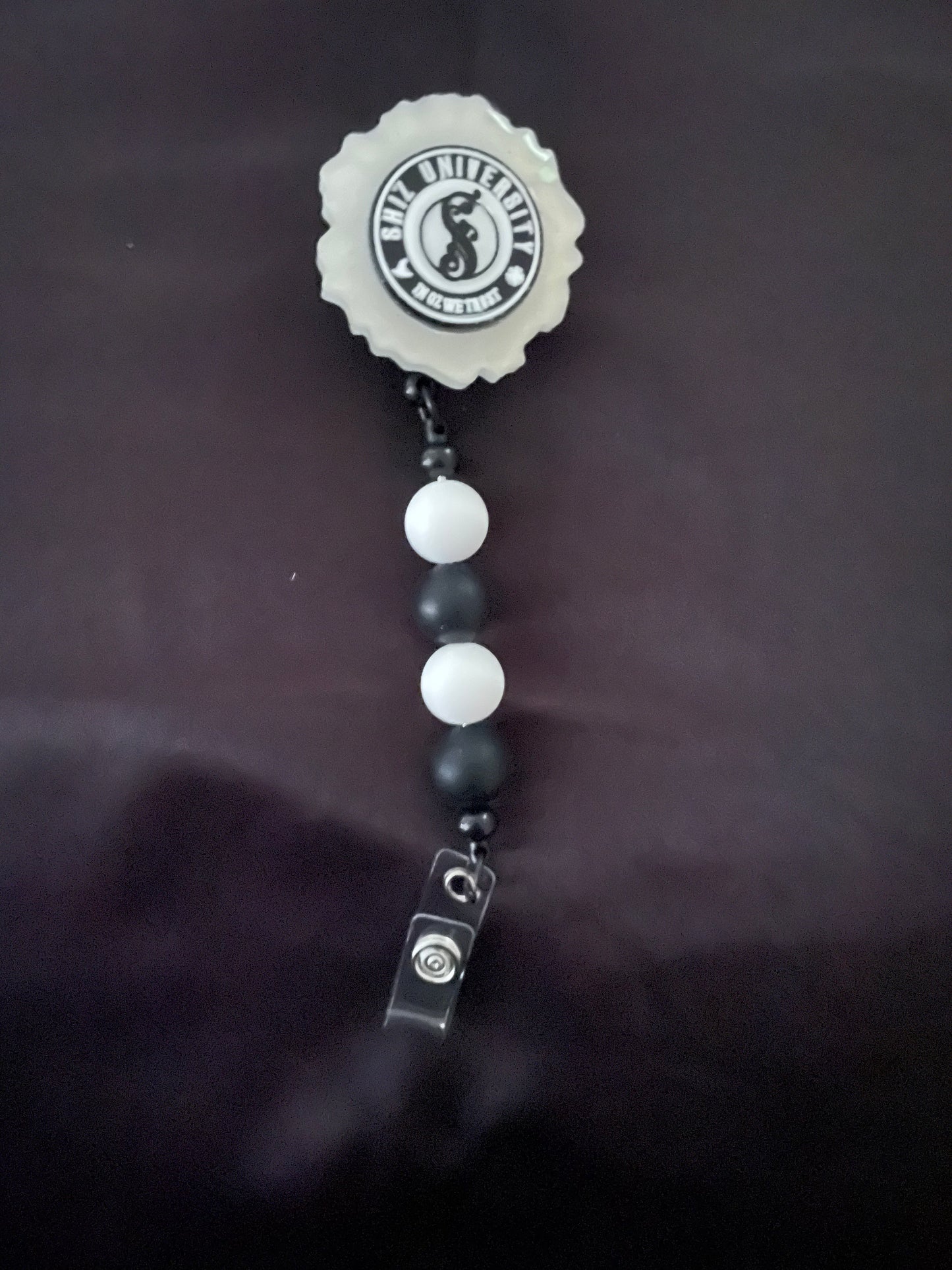Wicked themed badge reels