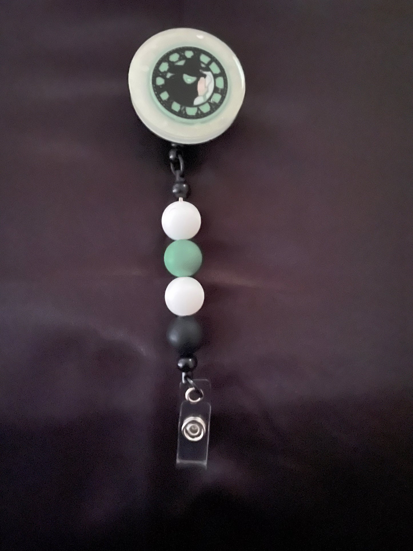 Wicked themed badge reels