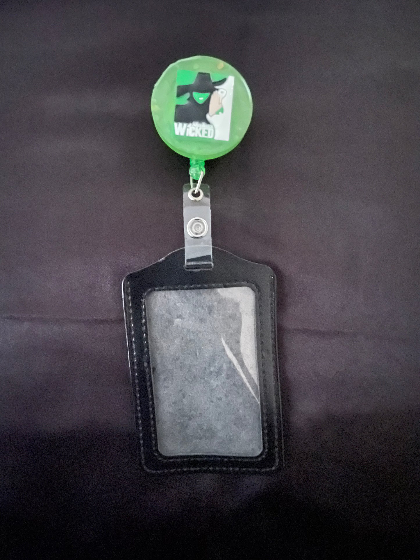 Wicked themed badge reels