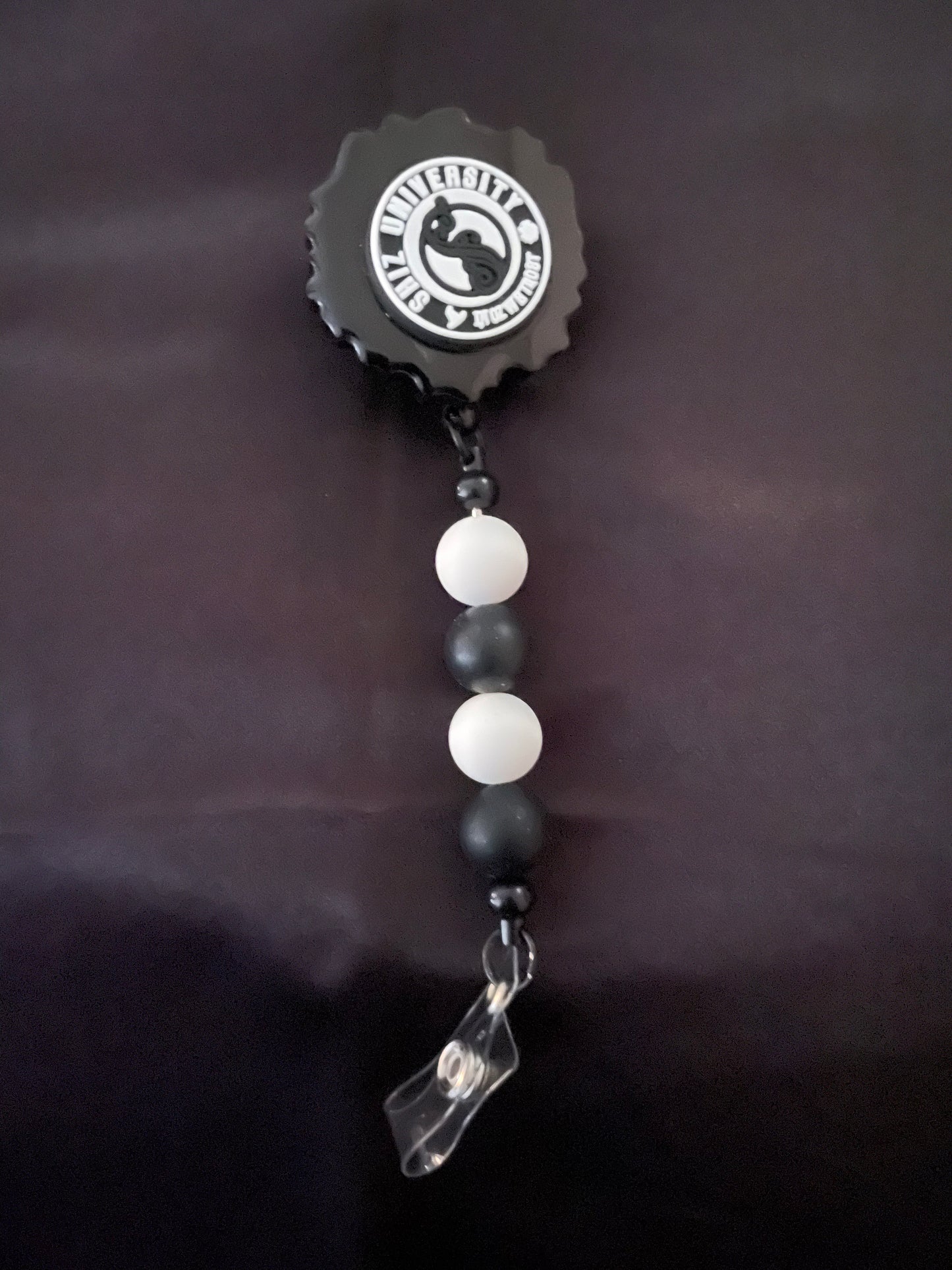 Wicked themed badge reels