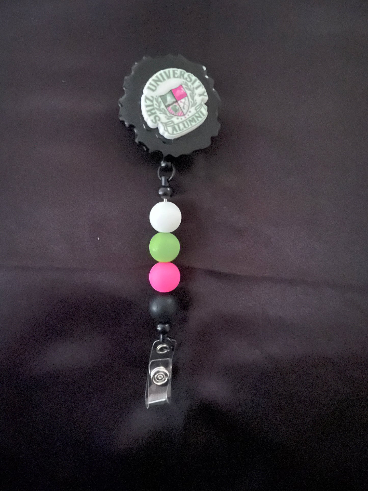 Wicked themed badge reels