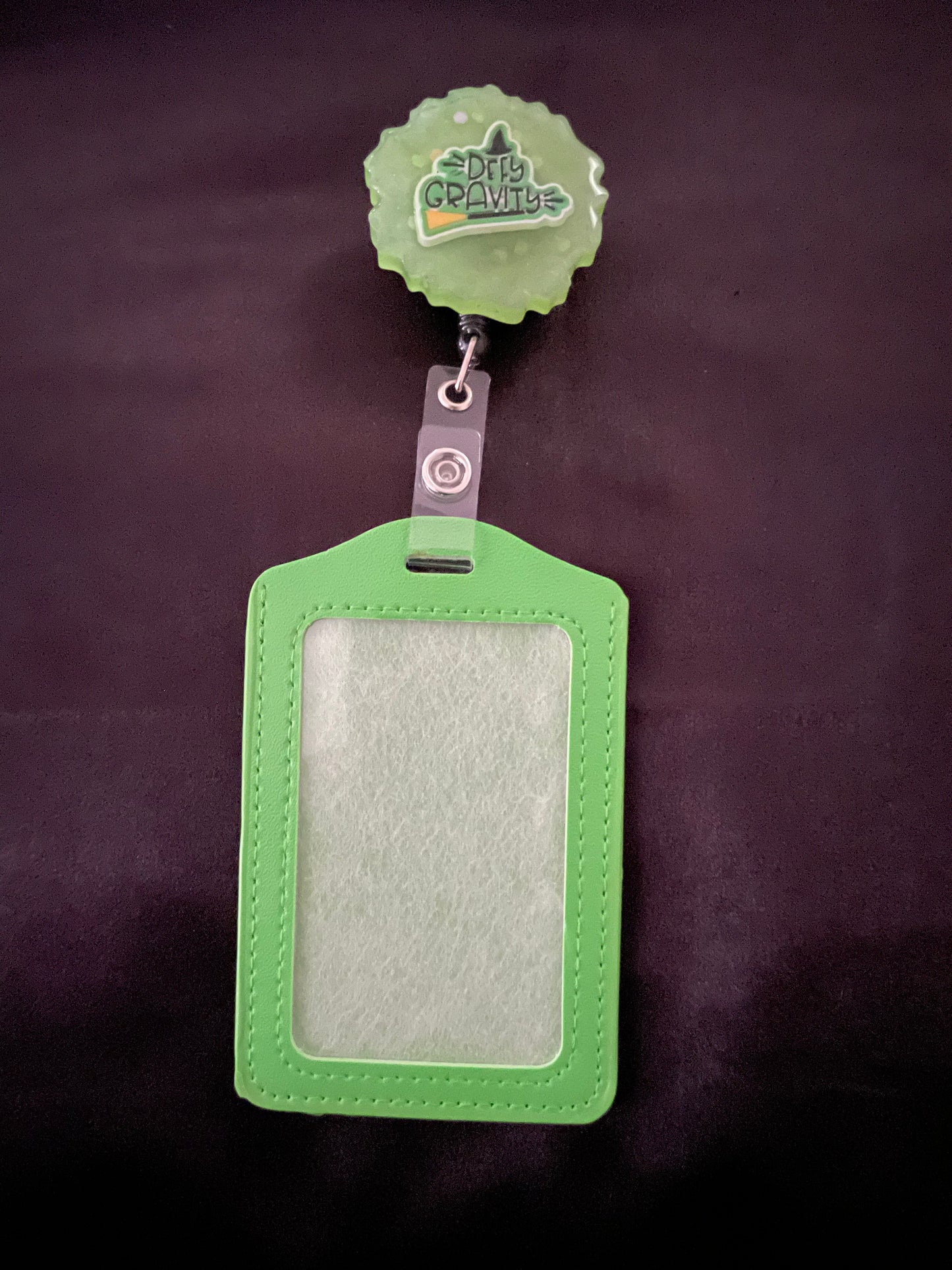 Wicked themed badge reels