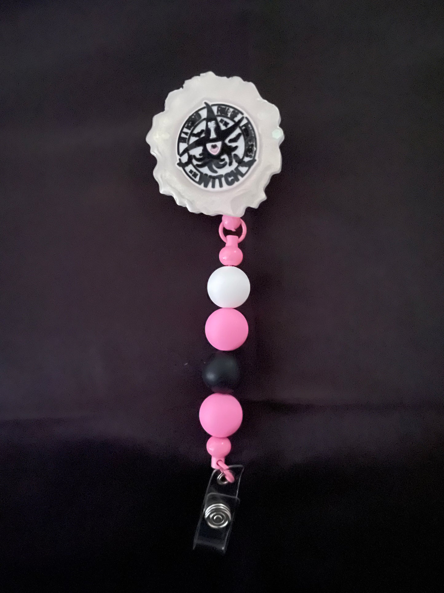 Wicked themed badge reels